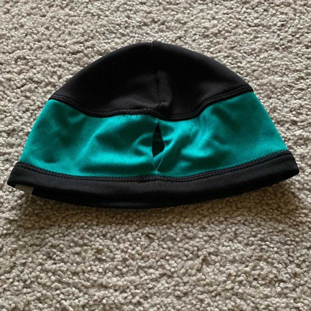 Black and teal hat gently used